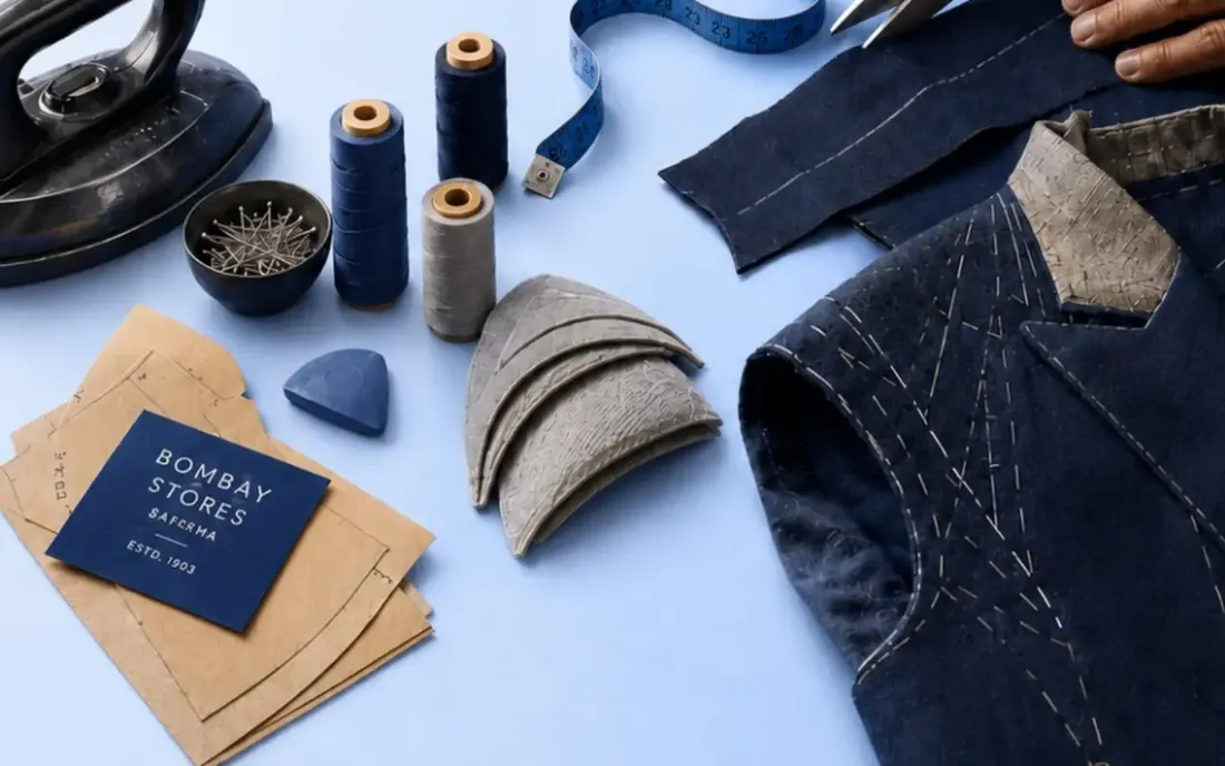 Scissors, iron, thread spools, tailor's chalk and workshop tools