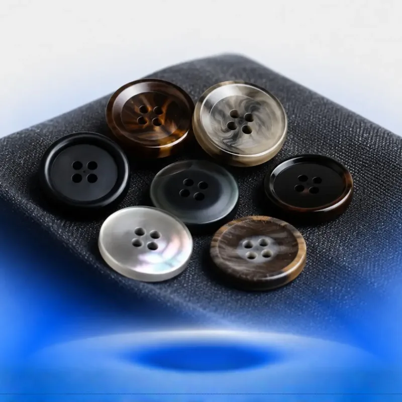 Horn, pearl and resin buttons on suiting fabric